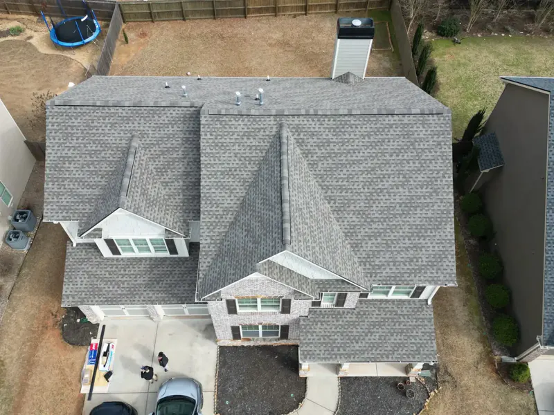 Two-story brick home with a new architectural shingle roof