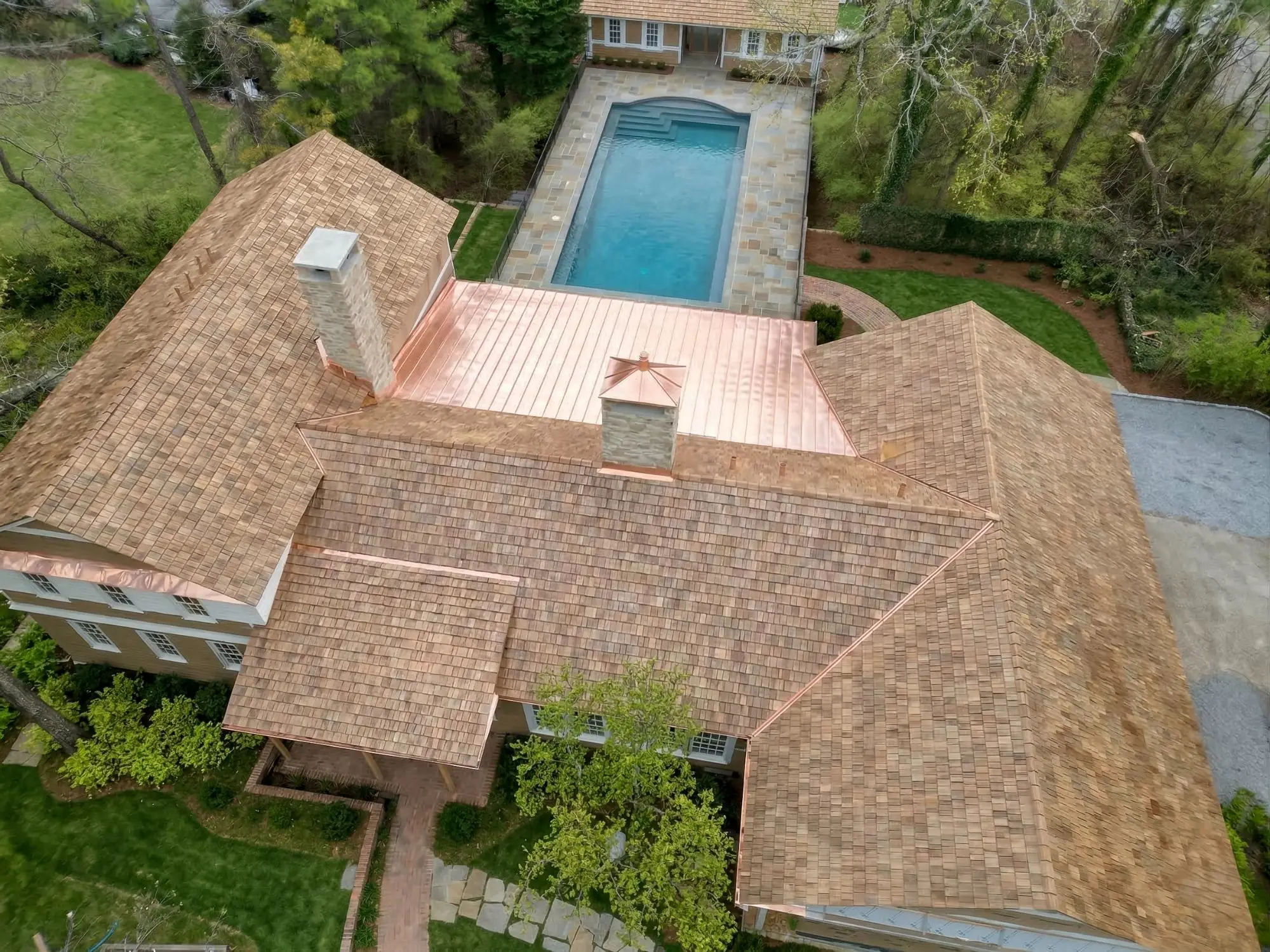 Aerial view of cedar shake and copper standing seam roof on a luxury estate in North Atlanta