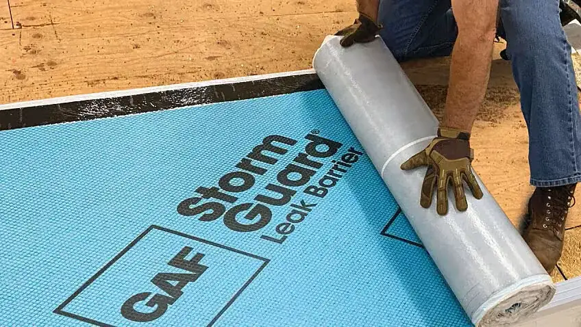 GAF StormGuard leak barrier being installed on roof deck