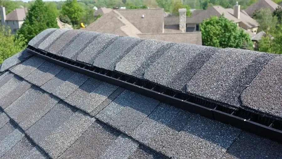 Close-up of ridge vent with cap shingles installed on finished roof