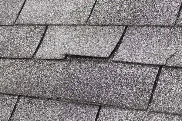 Aged 3-tab shingles past warranty on a Holly Springs home
