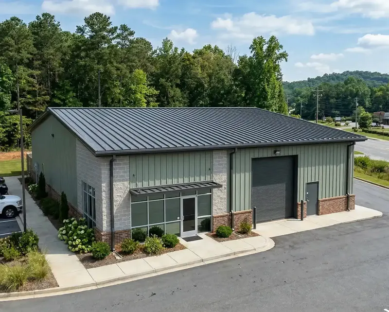 Screw-down metal roof on a commercial outbuilding in North Georgia